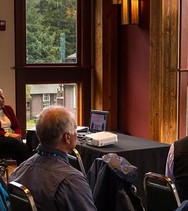 Members in conference room viewing presentation on screen at the ATIA Annual Convention